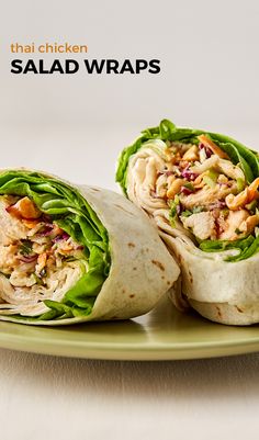 two wraps filled with chicken, lettuce and nuts on a green platter