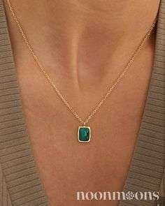 Malachite Rectangular Pendant Necklace ☽  This necklace features a gold chain adorned with a striking rectangular pendant. The pendant showcases a malachite gemstone, known for its deep, rich green color and distinctive swirling patterns. The malachite is set in a sleek, rectangular frame that complements its natural beauty. This refined design merges classic sophistication with a touch of contemporary style, making it a versatile piece that can effortlessly elevate both everyday and formal outf Clavicle Chain Necklace With Rectangular Pendant, Rectangular Gold Plated Necklace, Gold Necklaces With Rectangular Stone, Rectangular Yellow Gold Emerald Necklace Gift, Gold Emerald Necklace With Square Pendant, Rectangular Gold Plated Necklace With Delicate Chain, Gold Oblong Necklace For Gift, Gold Emerald Necklace With Rectangular Pendant As Gift, Gold Emerald Necklace With Square Pendant For Gift