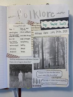 an open notebook with some pictures and words on the pages, including one person standing in a forest