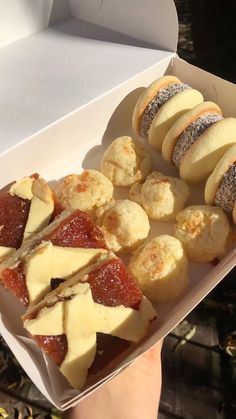 a box filled with different types of pastries