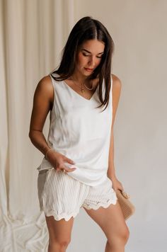 Front view of female model wearing the Monroe Off White Satin Tank Top that has off white satin fabric and a v-neckline. Satin Tank Top, Travel Dress, Jumpsuit Shorts Rompers, Maxi Dresses Casual, Romper Pants, White Satin, Casual Denim, Short Jumpsuit, Satin Fabric