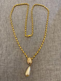 This Monet signed gold tone chain and signed Roman rhinestones with faux pearl pendant necklace is in excellent condition. Pendant shape is teardrop with a lobster closure. Chain is 27 inches long with a 1 3/4" long drop pendant. As you can see in the picture, one of the rhinestone is missing. Selling it as is. Non-smoking home. As always, please scroll pics for details & condition. Shipping is for actual cost based on weight and zip code.- Please note, most of my store's items are vintage or pre-owned. Most items are in very good/good vintage pre-owned condition.- Thank you so much for shopping with me and please check out my other jewelry listings, I post new items daily! Pearl Pendant Necklace, Zip Code, Drop Pendant, Pearl Pendant, Faux Pearl, Necklace Etsy, Jewelry Necklace Pendant, Gold Tones, Jewelry Necklaces