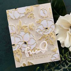 a close up of a greeting card with flowers