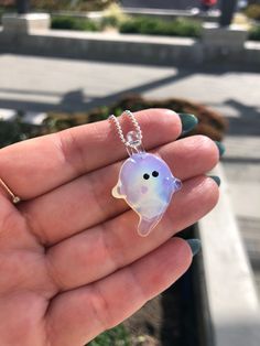 "New one-of-a-kind sparkly ghostie pendant is hand sculpted with high end Borosilicate glass mixed with sterling silver oxide. Borosilicate glass (Pyrex) is stronger and can withstand extreme temperatures compared with regular glass.  Approximately 1\" wide x 1.25\" long  Pendant comes with black paracord or with a stamped sterling silver 1 mm Italian made snake or ball chain. Select your chain length when checking out.  Please note that piece is completely handmade and is one of a kind. Therefore, sizes are approximate and design is one of a kind and the opal will vary from the piece seen in the photos  Made with love in Vancouver, BC Canada  Thanks for supporting my art! Mona xx" Unique Glass Pendant Necklace, Ghost Jewelry, Beach Core, Ghost Necklace, Heady Glass, Unique Glass Necklace Pendant Folksy, Ocean-inspired Silver Glass Necklace, Glas Art, Long Pendant