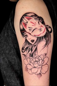 a woman with a cat's head and flower tattoo on her arm is shown