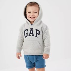 Arch Logo Hoodie Gap New With Tag Toddler Boy Sizes: 5t / 5 Years Color: Heather Gray Fabric & Care 77% Cotton, 23% Polyester Machine Wash. Imported. Overview Designed Exclusively For Factory Stores. Soft, Comfy Fleece. Long Sleeves With Ribbed Cuffs, Hem. Hood With Contrast Jersey Lining. Embroidered Arch Logo Applique At Front. Kanga Pocket. **Smoke Free / Pet Free** Adjustable Hood Hoodie For Playtime In Fall, Sporty Hooded Hoodie For Playwear, Gray Tops For Winter Playtime, Hooded Winter Sweatshirt For Playwear, Winter Hooded Sweatshirt For Playwear, Casual Hoodie Top For Playtime, Casual Long Sleeve Hoodie For Playtime, Casual Hooded Hoodie For Playtime, Sporty Long Sleeve Sweatshirt For Playtime