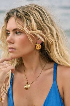 The stunning Dune Earrings will have you feeling like you're on a luxurious resort vacation every single day. A super lightweight beachy statement vibe. Features: 14k gold bonded to stainless steel Water safe and tarnish resistant 2.5cm x 3cm shell shape Stud and butterfly closure Ammonite Shell, Luxurious Resort, Resort Vacation, Gold Bond, Vacation Resorts, The Dunes, Shell Earrings, Shell Pendant, Steel Water