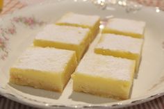 three squares of lemon cake on a plate