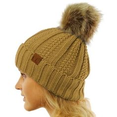 We are adding a little cold weather fun to our most loved C.C beanie. These pom beanies have an added pom on the top of them are lined on the inside. They are comfy, warm, and oh so cozy. The little leather tag is stamped with a registered C.C Size: One Size.  Color: Beige.  Gender: unisex.  Age Group: adult. Bulky Knit, Pom Pom Beanie Hat, Cc Beanie, Ski Hats, Leather Tag, Winter Hats For Women, Faux Fur Pom Pom, Pom Beanie, Comfy Cozy