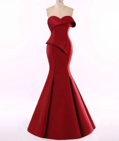 This red strapless evening gown from #DallasTexas #Designer can be made in any color or with any design changes you need. When the garment is being made to order you can request any fabric you prefer as well. We have many other evening #gowns in our collection that you can consider on our main website. Contact us directly for more info on our process and how we work with long distance clients all over the globe. Strapless Evening Ball Gown With Sweep Train, Strapless Ball Gown With Sweep Train For Evening, Elegant Red Strapless Dress, Fitted Strapless Ball Gown For Gala, Elegant Fitted Strapless Ball Gown, Elegant Red Strapless Ball Gown, Strapless Evening Gown For Prom Season, Elegant Red Strapless Mini Dress, Strapless Gown For Prom