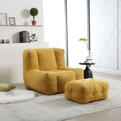 a yellow chair and ottoman in a living room with a white rug on the floor