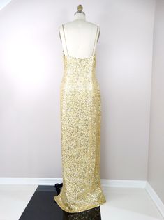 "This is a show-stopping gown. It's fully embellished with shiny gold, metallic gold, iridescent gold sequins and accented with tiny gold beading between each and every sequin. Absolutely amazing and it's in perfect condition! Measurements: Bust - 38-42\" Waist - 32-36\" Hips - 40-44\" Dress Length - 62\" Size - 12 (please refer to measurements) This dress comes from a pet-free and smoke-free home. If you would like more info or have any questions, please don't hesitate to ask!" Luxury Gold Sequin Gown, Luxury Gold Gown With Sequins, Glamorous Gold Sparkling Evening Dress, Glamorous Gold Sequin Fabric For Prom Season, Gold Fitted Gown With Sequins, Gold Sequined Evening Gown, Gold Shimmer Evening Dress For Prom, Gold Sequin Gown For Evening, Gold Glitter Evening Dress For Wedding