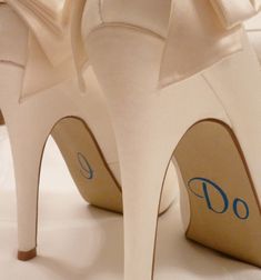 the bride's wedding shoes are decorated with bows