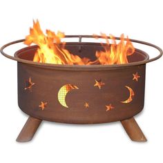 an outdoor fire pit with stars and crescents on the side, in front of a white background