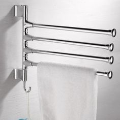 a towel rack with four towels hanging on it