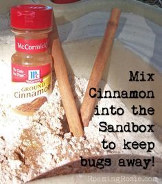 cinnamon and sand in a bowl with two wooden spoons