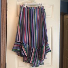 Multicolor Striped Skirt With Asymmetrical Bottom Multicolor Asymmetrical Lined Skirt, Multicolor Flowy Asymmetrical Skirt, Chic Blue High-low Hem Skirt, Multicolor Midi Skirt, Casual Multicolor Asymmetrical Maxi Skirt, Casual Multicolor Asymmetrical Skirt, Multicolor Asymmetrical Skirt For Spring, Spring Multicolor Asymmetrical Skirt, Blue Asymmetrical Hem Skirt With Relaxed Fit