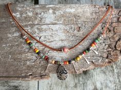 This uniquely designed short necklace is lightweight multi-strand short Boho/Tribal  in a gorgeous mix of colors. Dress it up or down, it will always be perfect!  Made from Ethnic seed beads, barrel bead, tierra cast charms, silver plated spacer beads, natural Kangaroo leather lace and cord. Size options available: Short strand measures 39cm, second strand 42.5, fitted with a 4cm extension chain. Or Short strand measures 41.4cm, second strand 44.5, fitted with a 4cm extension chain. Bohemian Multicolor Beaded Necklace With Adjustable Length, Bohemian Beaded Choker Necklace, Bohemian Multicolor Adjustable Necklace, Bohemian Festival Layered Choker Necklace, Bohemian Pendant Choker, Bohemian Boho Choker Necklace, Bohemian Boho Collar Choker Necklace, Bohemian Choker Necklace With Boho Collar, Bohemian Multi-strand Choker For Festival