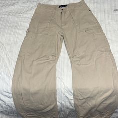 Never Worn! Fits Size 6-8 Very Long Pants Beige Wide Leg Cargo Pants With Five Pockets, Beige Bottoms With Hip Pockets, High Waist Beige Utility Bottoms, Beige Full-length Bottoms With Pockets, Beige Five Pocket Pants For Streetwear, High Waist Beige Pants With Pockets, Beige Five-pocket Pants For Streetwear, Beige Full Length Bottoms With Pockets, Beige Streetwear Pants With Five Pockets