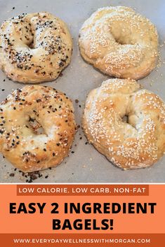 four bagels sitting on top of a baking sheet