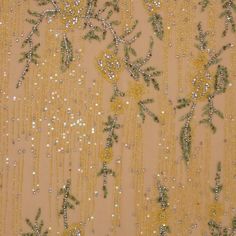 an image of gold sequins and flowers on sheer fabric with beaded mesh