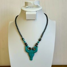 Cooling To The Touch Hematite Beaded Black Necklace Featuring Blue Bull Horn Pendant And Matching Howlite Beads. Turquoise And Black Beads Necklace For Jewelry Making, Adjustable Turquoise Jewelry With Black Beads, Turquoise Beaded Necklaces With Black Beads As Gift, Gift Turquoise Beaded Necklaces With Black Beads, Turquoise Jewelry With Black Beads For Gift, Turquoise Jewelry With Black Beads, Turquoise Necklace With Black Beads As Gift, Bull Horns, Horn Pendant