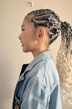 This fun and lively cornrow hairstyle has braids woven tightly together that start at the front of the head and go to the back, where they come together into a flowing ponytail. The braids are carefully put together with sections that make a shapes pattern on the scalp, showing how neatly and thoughtfully it was done. To add some silliness, - Click to see more of 20 Cute and Stylish Cornrow Hairstyles for Children. and follow us for more hairstyle ideas. // Photo Credit: Instagram @r_a_r_y_o___ Shapes Pattern