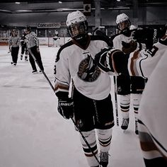 the hockey players are warming up on the ice for their team's next game