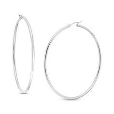 Simple and classic, these earrings are great for any daytime look. Fashioned in cool 14K white gold, these 2.0 x 60.0mm hoop earrings are finished with a bright finish. These earrings secure comfortably with latch backs. Everyday Oval White Gold Hoop Earrings, Minimalist White Gold Hoop Earrings For Formal Occasions, Classic White Gold Tarnish Resistant Hoop Earrings, Classic Tarnish Resistant White Gold Hoop Earrings, Classic White Gold Tarnish-resistant Hoop Earrings, Hypoallergenic White Gold Hoop Earrings, Classic Sterling Silver Hoop Earrings With Ear Wire, Minimalist Hoop Earrings With Shiny Finish, Classic Sterling Silver Hoop Earrings