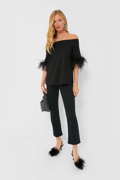 A fan favorite, now updated with feathers for an extra bit of fun, the Black Miranda Off The Shoulder Blouse is our idea of a good time. Modern and chic with a minimalist silhouette, this effortlessly elevated top is made from a soft fabric with elbow-length sleeves and a swingy A-line shape that's sure to flatter. Pair with denim and bold jewelry for an elevated date night look, or go for the coordinating Feather Ashford Pants and a clutch for party time! Off-the-shoulder neckline Elbow-length Elegant Feathered Evening Tops, Spring Evening Tops With Feather Trim, Fitted Feathered Tops For Fall, Chic Evening Top With Feathers, Fitted Feather Tops For Fall, Fall Party Tops With Feather Trim, Feather Trim Tops For Fall Party, Chic Feathered Tops For Fall, Black Feather Trim Top For Evening