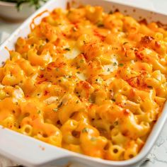 a casserole dish with macaroni and cheese in it on a table