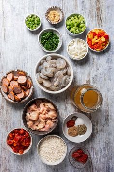 several bowls filled with different types of food on top of a wooden table next to each other