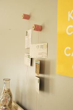 there is a vase on the table next to some papers and tape dispensers