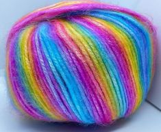 a multicolored ball of yarn on a white surface