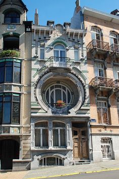 an old building with many windows and balconies