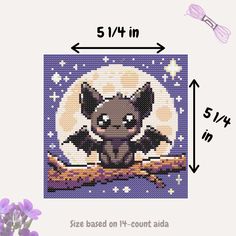 the cross stitch pattern is shown with an image of a bat on a tree branch