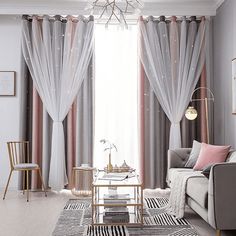 a living room filled with furniture and curtains