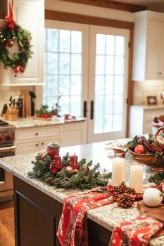 a kitchen decorated for christmas with candles and decorations