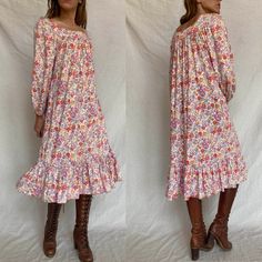 Jane Schaffhausen for Belle France 1970s floral ruffle prairie dress! So pretty and comfy, with pockets! Material tag hard to read, but says cotton & rayon and feels like a little jersey also. Has normal signs of wear for age with no major stains or damage. Approx small/medium or one size fits all, see measurements below: MEASUREMENTS: Bust: approx 19" across Hips: free Length: 43" Sleeve: 22" All sales final, please ask any questions and check measurements before purchasing. Peasant Prairie Dress With Ruffles For Gatherings, Spring Cotton Prairie Dress In Peasant Style, Spring Cotton Prairie Dress For Gatherings, Peasant Style Prairie Dress With Ruffles For Spring, Cotton Prairie Dress For Spring In Pastoral Style, Prairie Dress With Ruffles For Daywear, Spring Peasant Style Prairie Dress With Floral Print, Spring Cotton Prairie Dress In Pastoral Style, Cotton Prairie Dress With Ruffles In Peasant Style