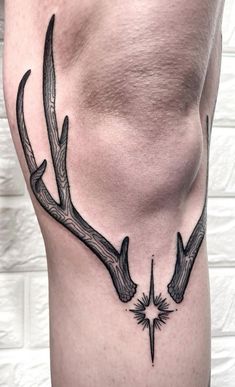 a man's stomach with antlers on it