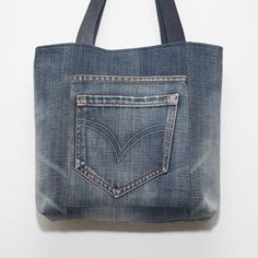 Rectangular Denim Bags With Pockets, Denim Blue Denim Bag With Zipper Pocket, Rectangular Denim Shoulder Bag With Zipper Pocket, Rectangular Denim Bag With Zipper Pocket, Denim Tote Bag With Zipper Pocket, Denim Blue Cotton Bag With Zipper Pocket, Medium Wash Cotton Shoulder Bag With Zipper Pocket, Daily Use Denim Shoulder Bag With Flat Pocket, Denim Shoulder Bag With Zipper Pocket For Everyday