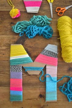 yarn and scissors laid out on a wooden table