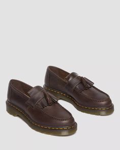 Be the envy of your friends with the cool Adrian Dark Brown Crazy Horse Tassel. Made from Crazy Horse leather - for a rugged, worn-in look - with a double tassel and kiltie fringe, this Docs loafer is stylish and ultra-durable. Plus, its legendary air-cushioned sole and signature yellow welt stitching make a statement wherever you go. Get your feet into some subcultural swagger! 8053 Quad, Brown Doc Martens, Dr Martens Loafers, Fred Perry Amy Winehouse, Brown Dr Martens, Black Platform Shoes, Fur Accessories, Tripp Nyc, Tassel Loafers