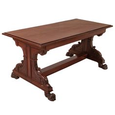 an old style wooden table with carvings on the top and bottom edge, sitting against a white background