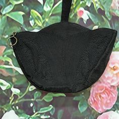 Vintage 1940's Genuine Corde triangle purse has a geometric design in black cord. It has a scalloped top with corded top handle. There are two outer compartments with a zipper section in the middle. Interior is black satin. Excellent condition inside and out. It does have some minor wear on the seams. Purse measures 10.5" wide at the top by 7" tall. Please see photos for more details. All items are vintage that are preowned. All of the items may show some form of wear due to their age. Please kindly remember that these items are anywhere from 30-80 years old. I make every attempt to clearly describe the item, including any flaws or wear to the best of my ability. Returns are not accepted based on the condition of the item. I urge you to the please contact me with any and all questions. I a Triangle Purse, Satin Noir, Zipper Top, Clutch Handbag, Black Satin, Geometric Design, Evening Bags, Purses And Handbags, Top Handle