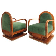 pair of art deco armchairs with green velvet upholster