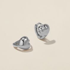 Heart goes padam padam in these hoops. Boo’s chubby heart motif, set on a 6mm huggie, are the sweetest addition to your ear stack. Minimal, sophisticated and chic, these shapely hoops will have hearts skipping beats. Created for you in the finest 14 karat white gold, you'll want to wear these earrings always and never take them off, even when working out or in the shower. Ear Stack, Jewelry Case, Polish Jewelry, Huggies Earrings, Leather Jewelry, Online Jewelry, Precious Metals, Ear Piercings, Gold Jewelry