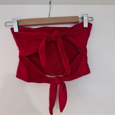 Tie Front Tube Top Never Worn Red Size M Red Crop Top For Summer, Trendy Red Crop Top For Summer, Casual Red Crop Top For Summer, Chic Red Top For Beach, Red Cotton Beach Crop Top, Red Cotton Crop Top For Beach, Chic Red Crop Top For Vacation, Casual Red Crop Top For Day Out, Red Cropped Top For Vacation