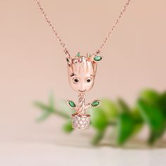 Each cartoon tree-inspired necklace is made of sterling silver, partially inlaid with white and green gemstones, designed so cute and super adorable. If you or someone you love is a baby tree at heart, each necklace is a must-have piece in your jewelry collection!Weight: 5.6 gWidth: 12.5 mmHeight: 25.9 mmThickness: 7.3 mmMaterial: 925 SilverPlating Color: Rose GoldLength: 450 mm Cartoon Tree, Tree Man, Emerald Green Stone, Dangle Necklace, Green Stones, Dangle Necklaces, Green Gemstones, Guardians Of The Galaxy, The Galaxy