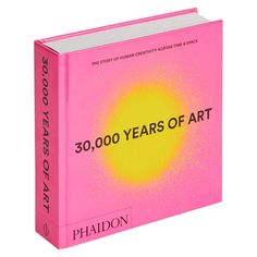 a pink book with the words 30, 000 years of art on it's cover